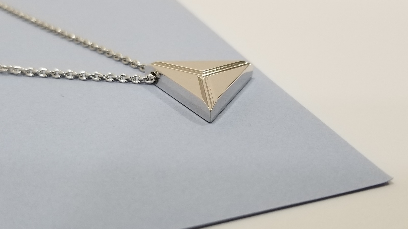 Triangle Brass pendant rhodium plated.